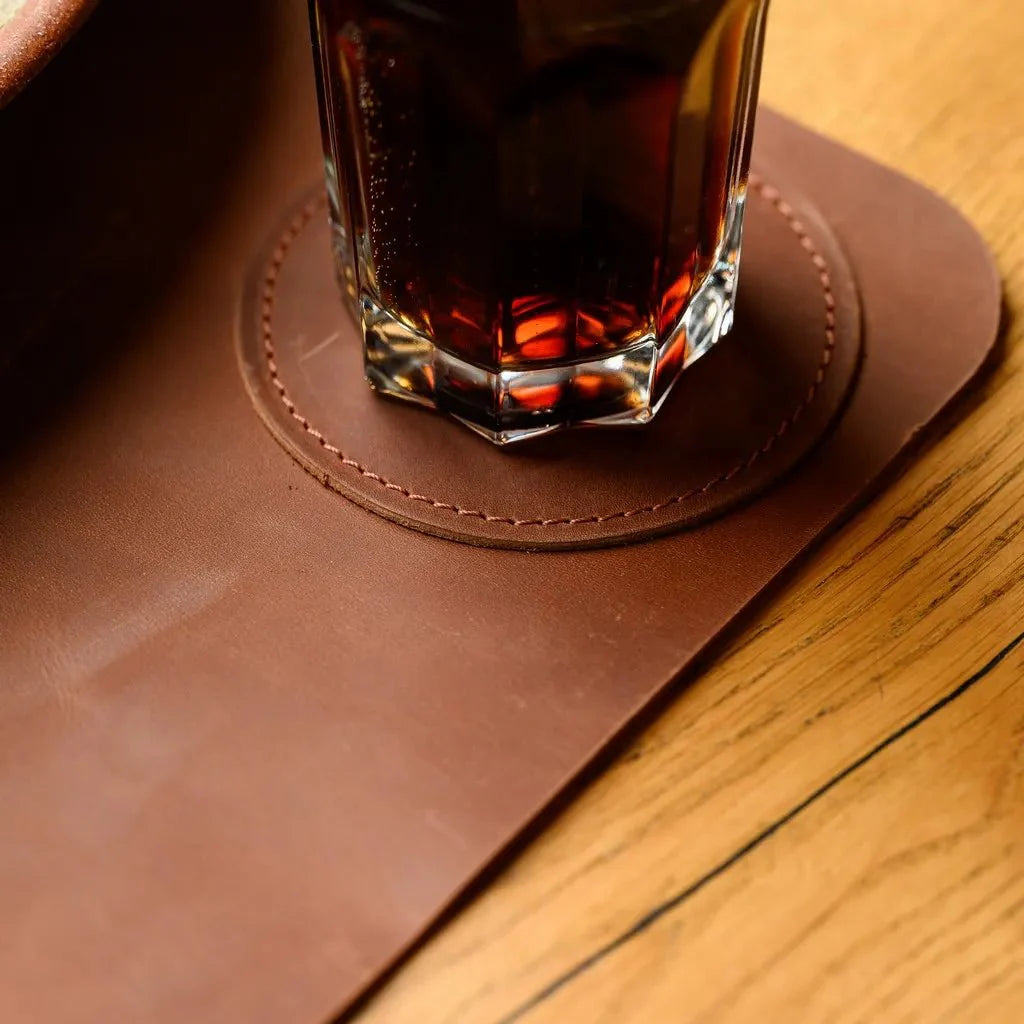 Vintage-style leather beer placemat with a rugged and distressed look, offering a unique character that develops with time, perfect for beer lovers.