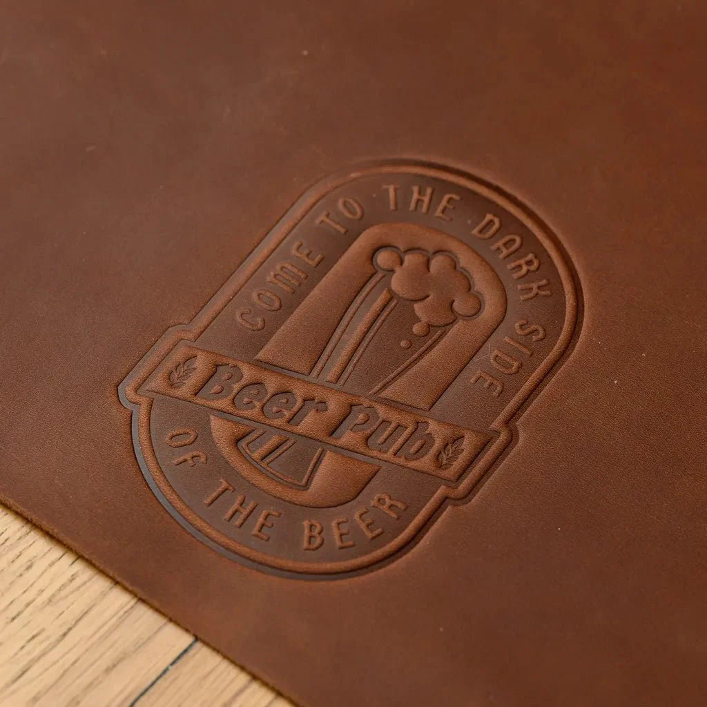 High-quality leather beer placemat designed for durability and style, featuring a natural wax coating that enhances its water resistance and longevity.