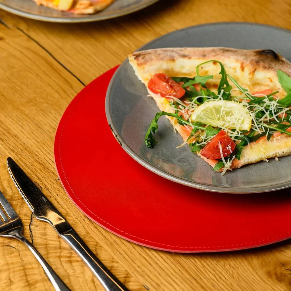 Upgrade your dining decor with a Circle-Shaped Placemat in Capri leather. Designed for durability and sophistication, it complements any table with timeless elegance.