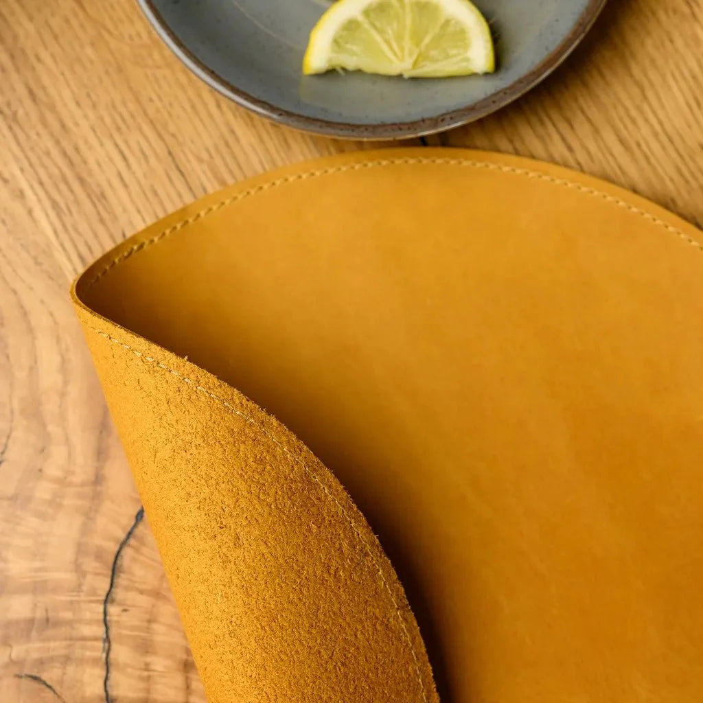 Round leather placemats for compact table serving