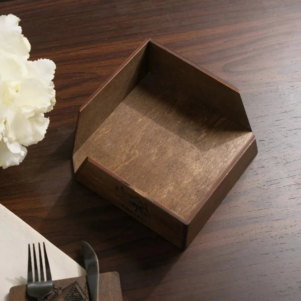 Eco-friendly wooden napkin stand made from sustainable materials.