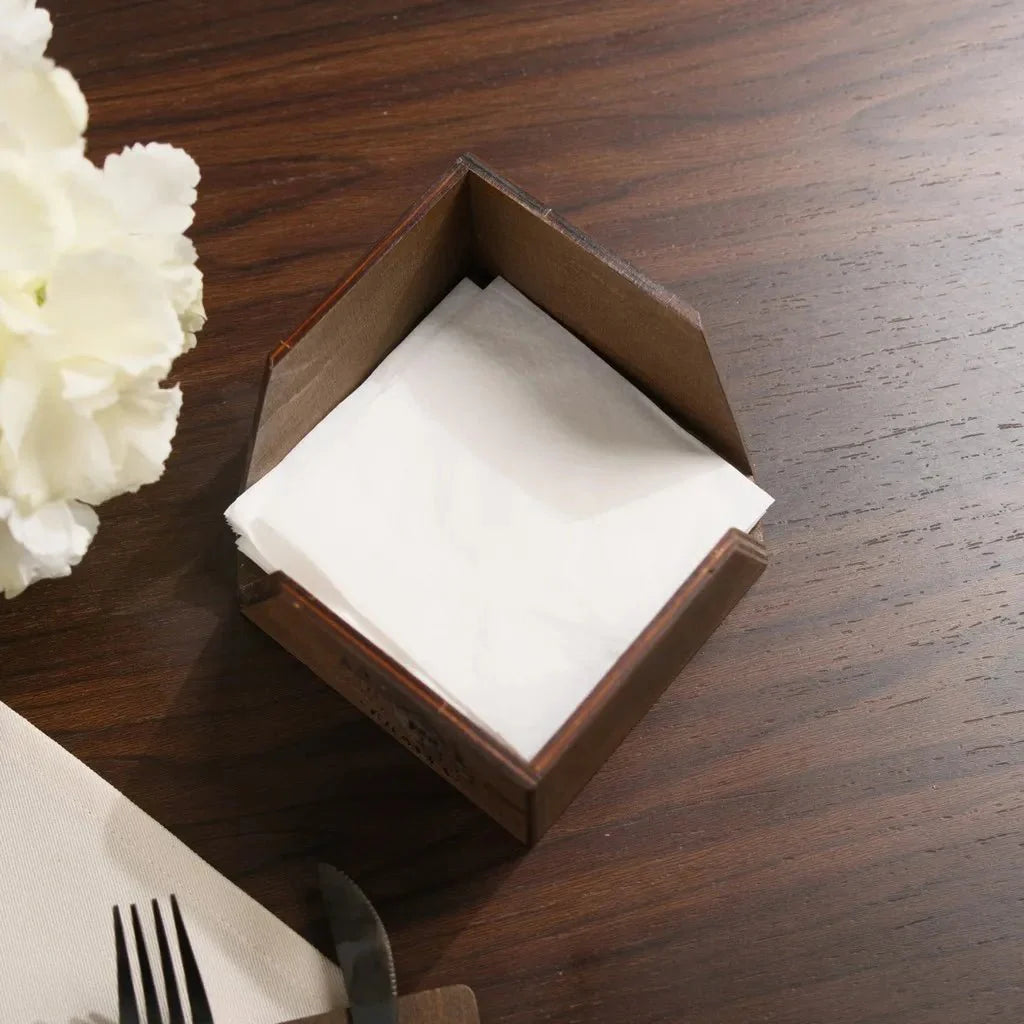 Decorative wood napkin dispenser with laser engraving.