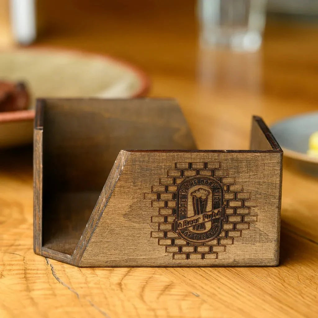 Rustic wooden napkin holder for restaurants and cafés.