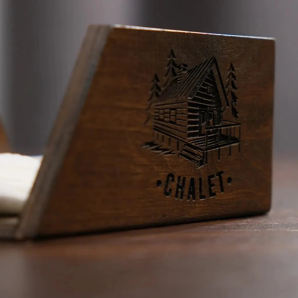 Elegant wooden napkin holder with a sleek finish.