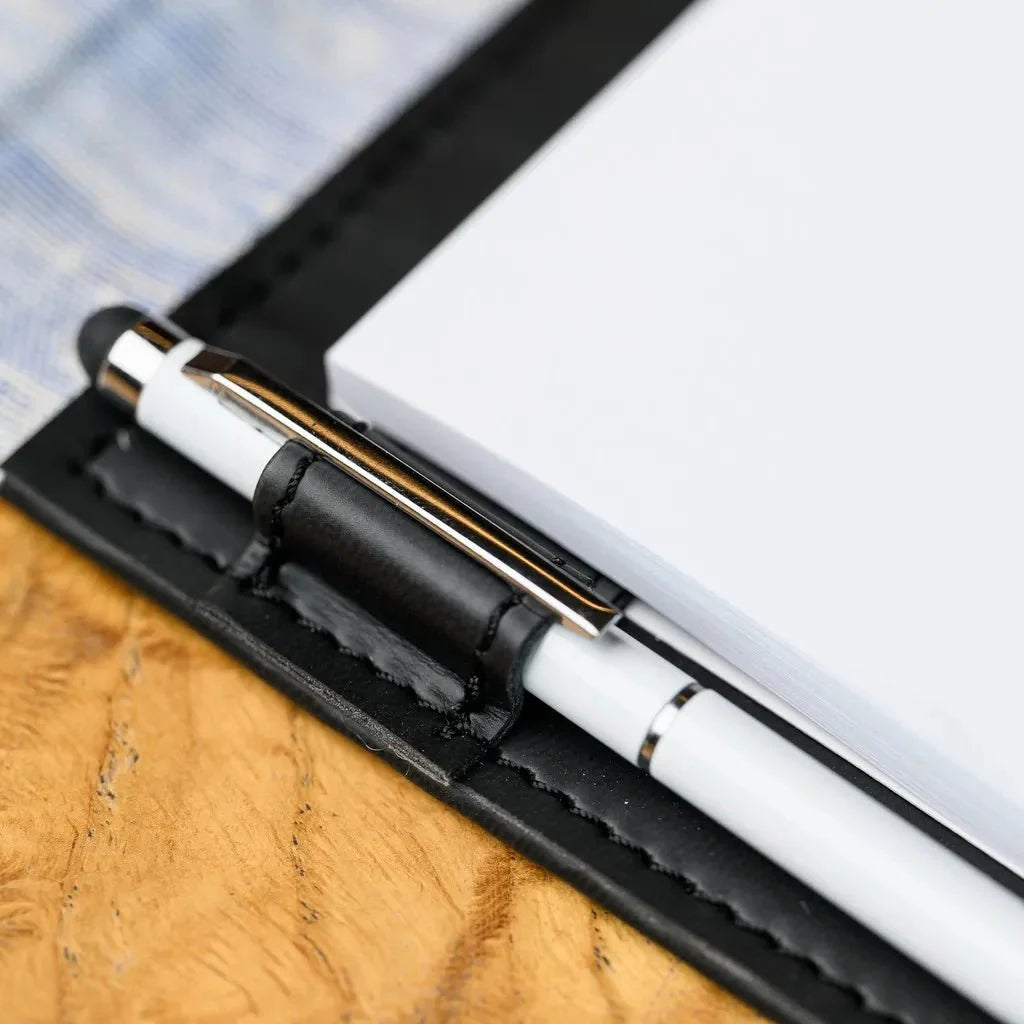 Waiter's fabric notebook, equipped with a reliable hardback design. This notebook's design prioritizes durability and professional appearance, making it perfect for the fast paced enviroment of resturants. It is made to be carried and used constantly.