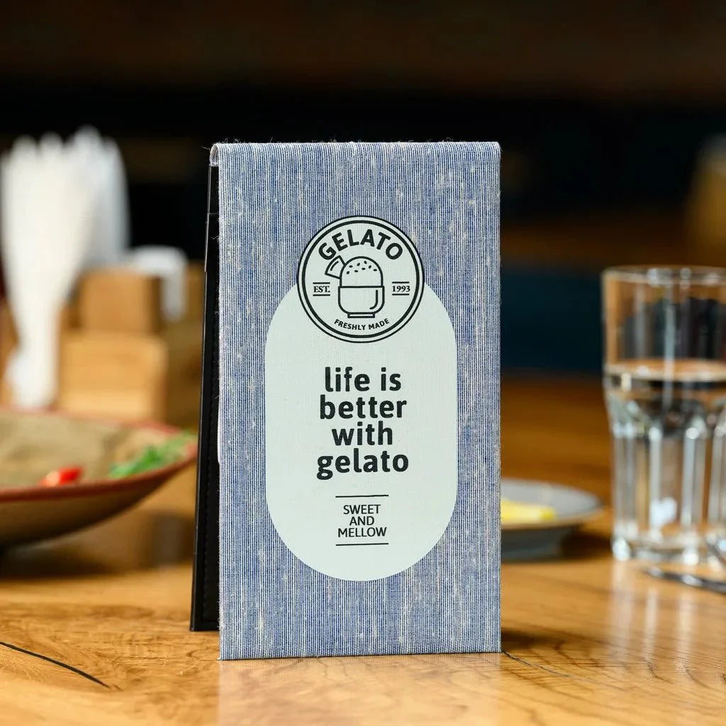 Image of a hardcover fabric notebook, an essential tool for waiters. The notebook's elegant fabric exterior provides a comfortable grip, while the hardback offers exceptional support for writing, ensuring clear and accurate order records throughout a fast-paced shift.