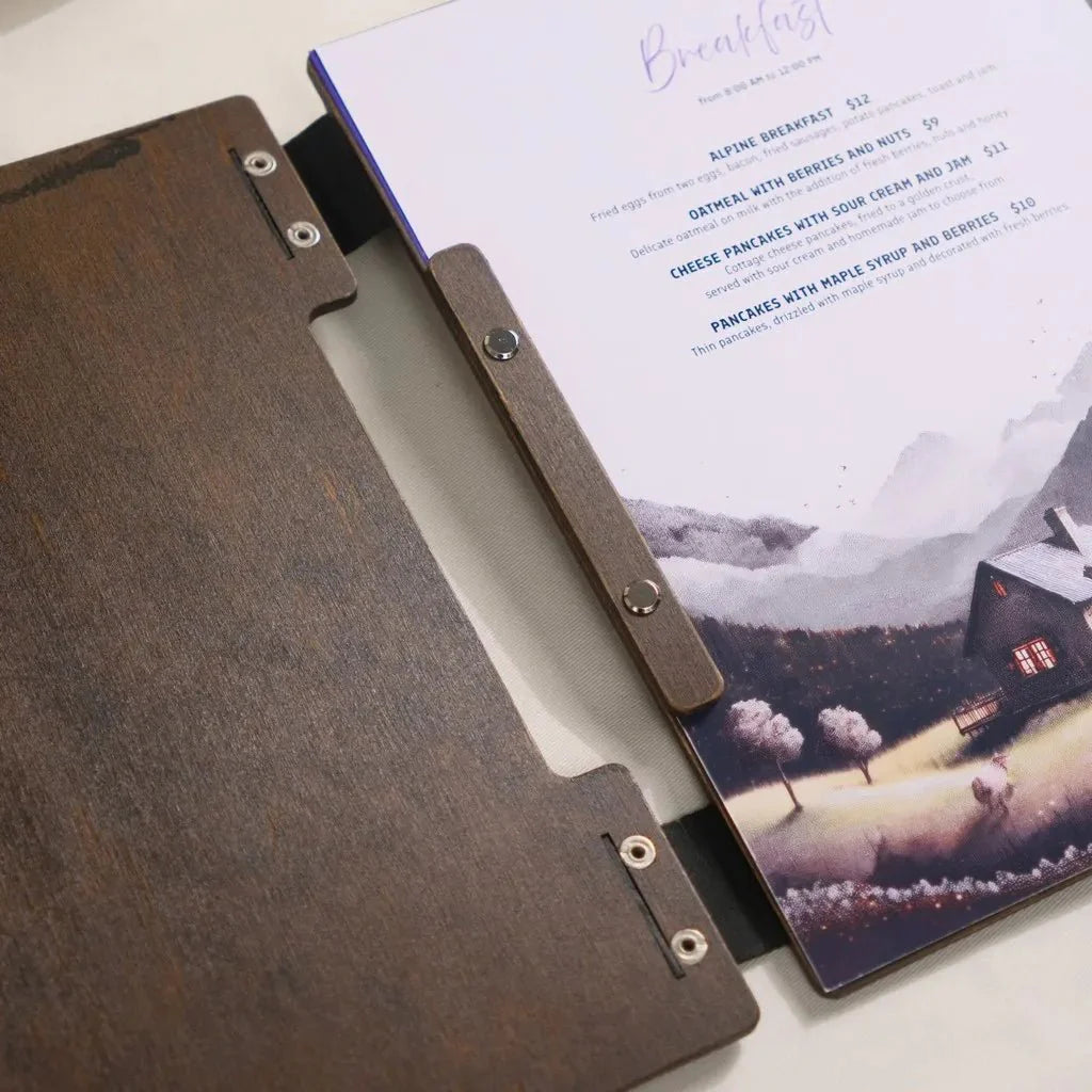 Bespoke wooden menu case featuring a laser-etched logo.