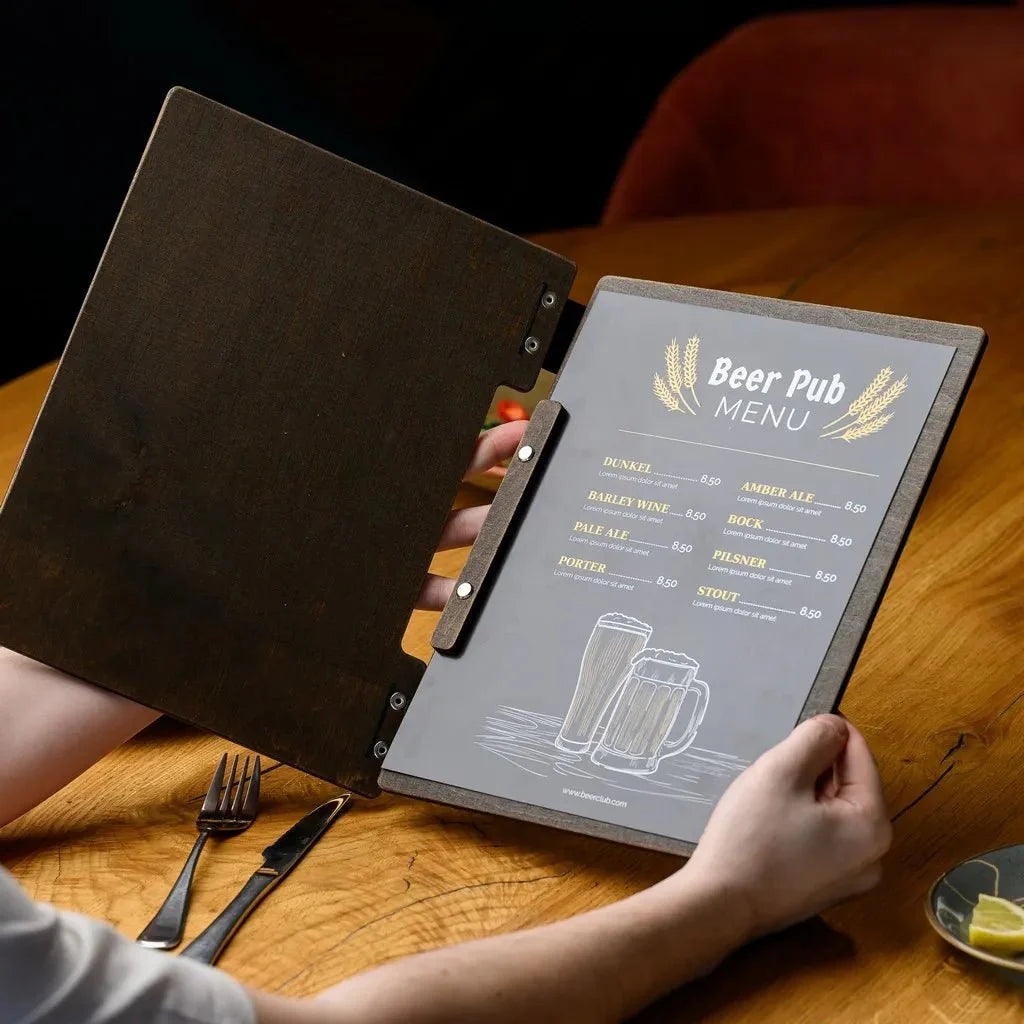 Premium wooden menu covers for restaurants with engraved details.