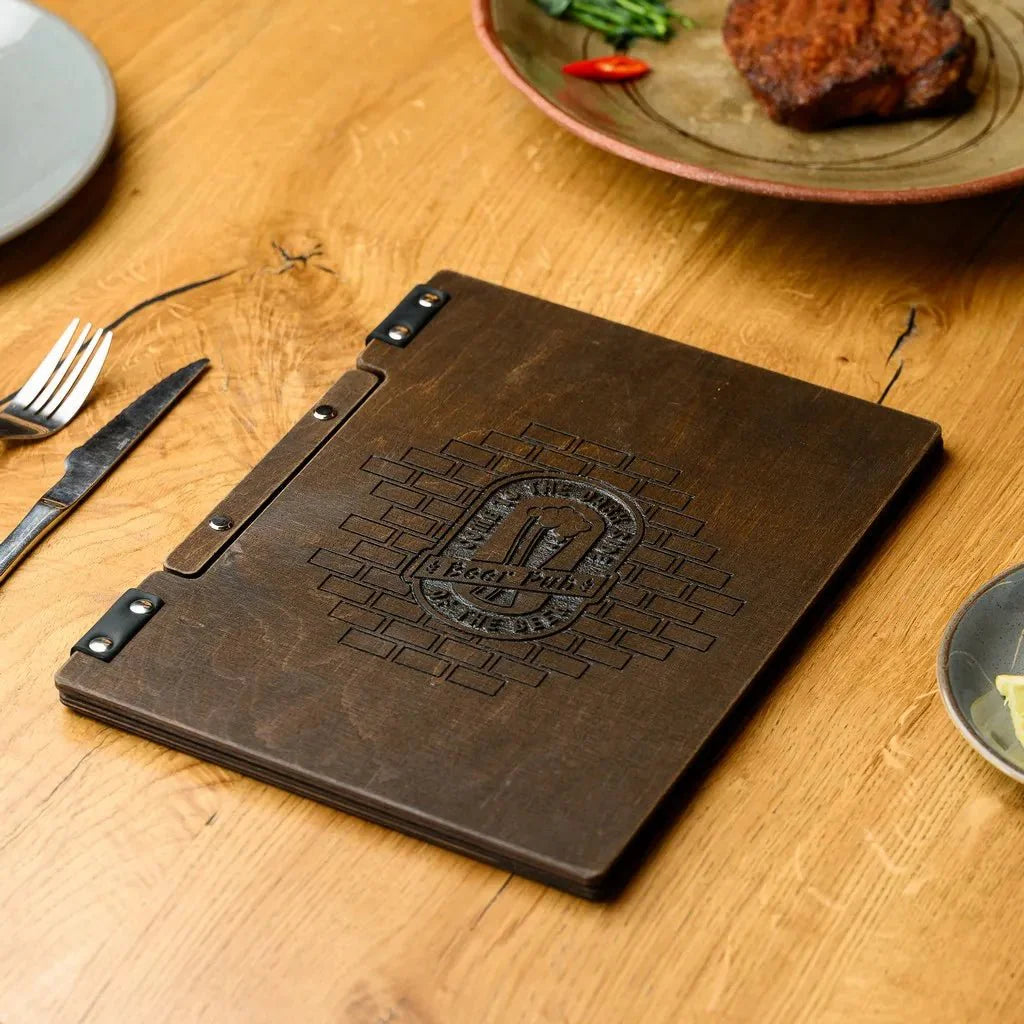 Custom wooden menu folder for restaurants with brand logo engraving.