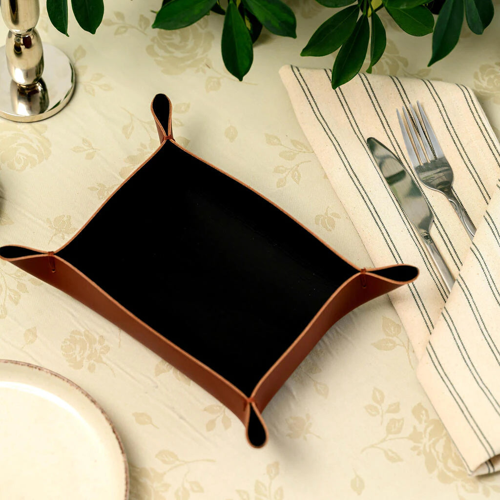 Elegant tan leather dining placemat. A professional handcrafted accessory for high-end hospitality branding and modern table aesthetics