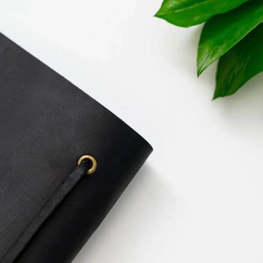 Compact menu booklet with a smooth leather cover.