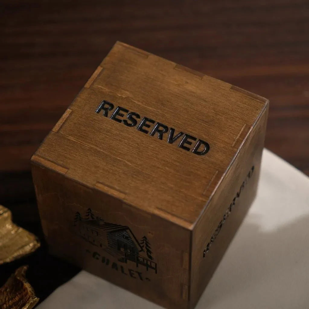 Premium wooden reserved table sign with deep logo engraving.