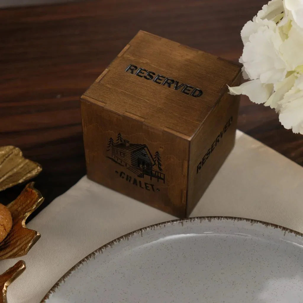 Rustic wood tabletop reserved marker with custom branding.
