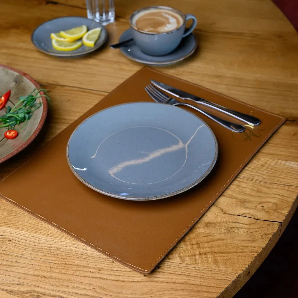 Sophisticated leather placemat with heat-resistant and wipeable surface.