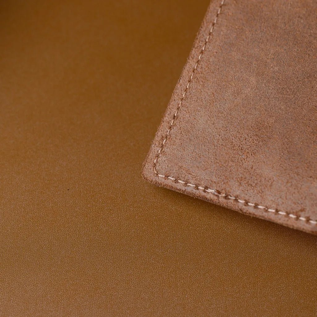 Durable Capri leather placemat with wipe-clean surface.