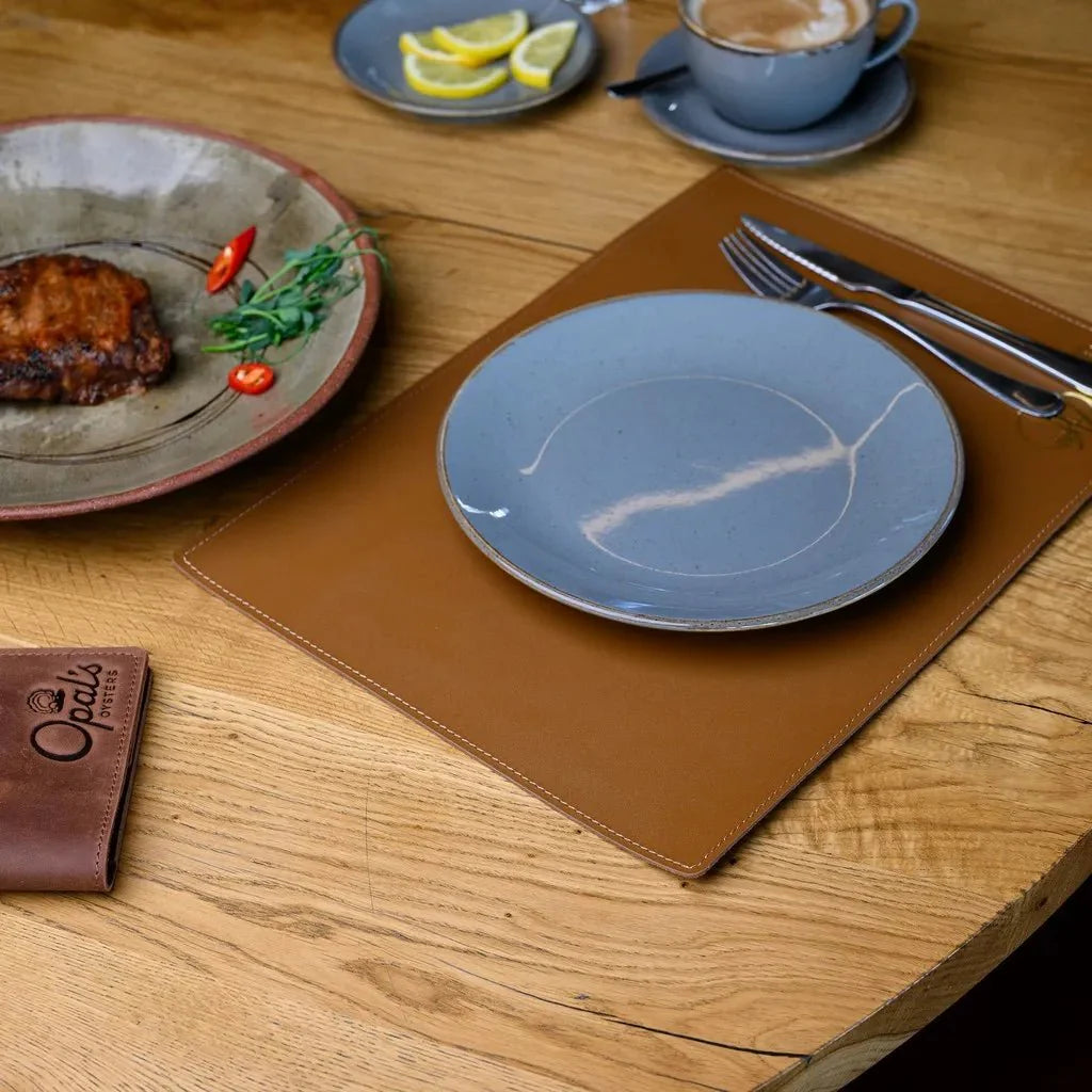 Rectangular Capri leather placemat enhancing dining table décor.