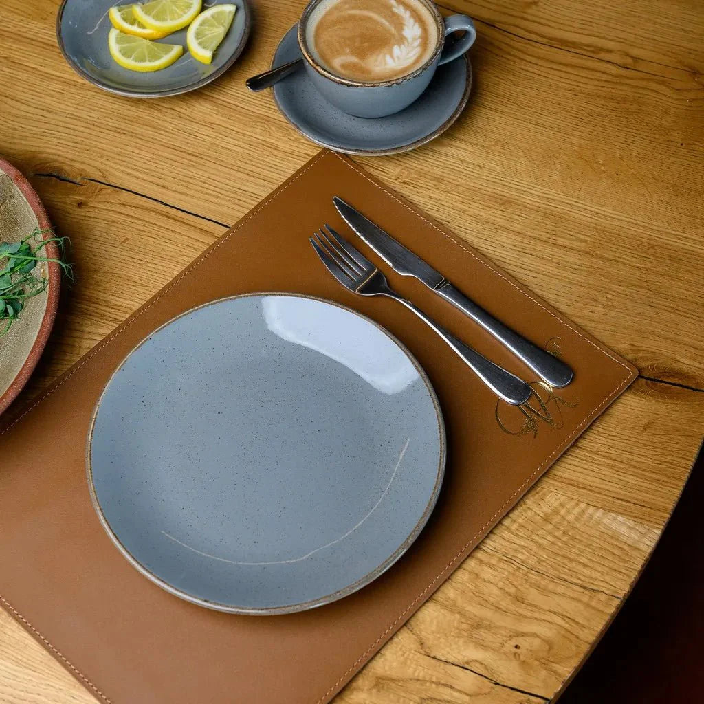 Elegant Capri leather placemat with heat and spill-resistant surface.