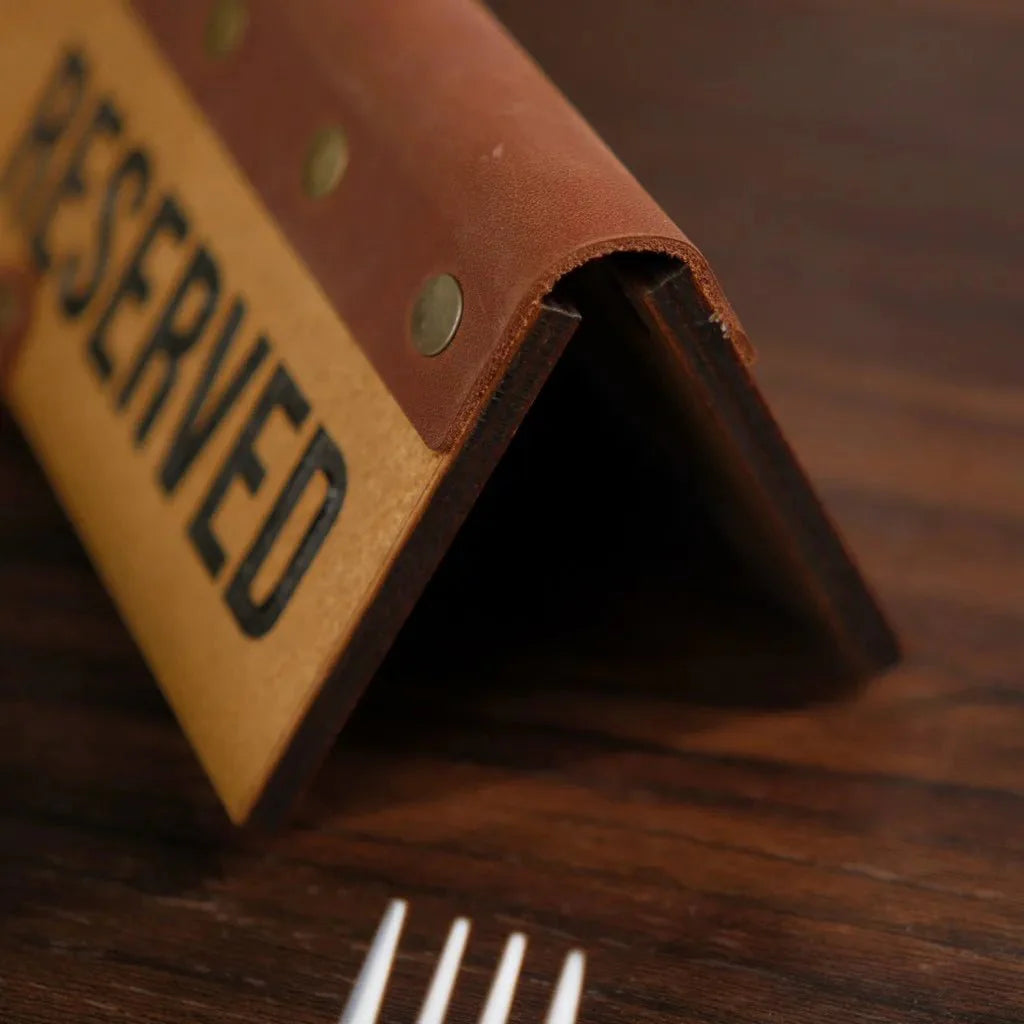 Custom wooden reserve plate with engraved details for personalization.