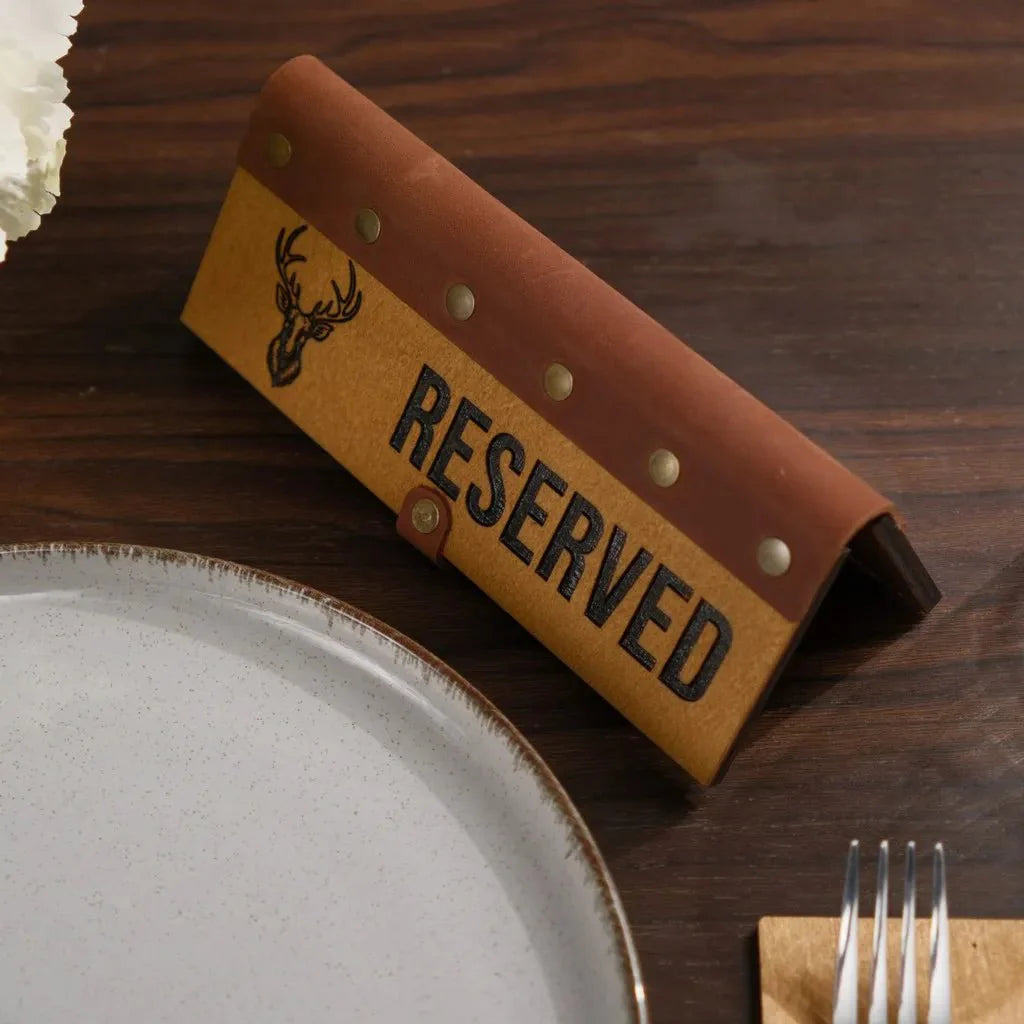 Unique wooden tabletop reserve plate with a natural wood grain.