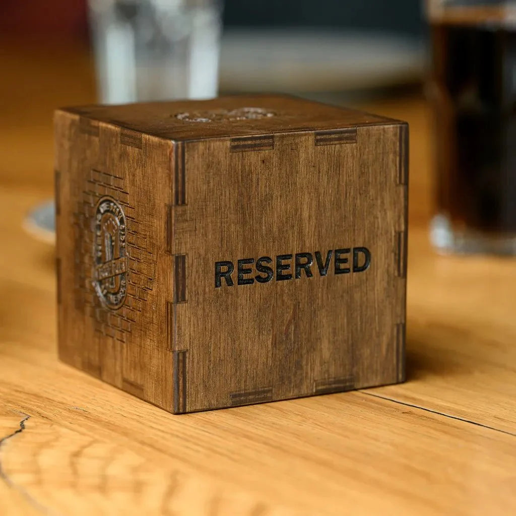 Eco-friendly wooden tabletop reserve plate for sustainable dining.