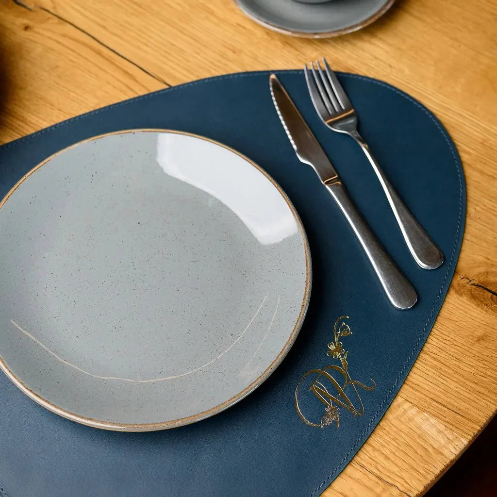 Stylish and functional Teardrop-Shaped Placemat made from Capri leather. A durable, easy-to-clean option for elevating your table decor with timeless elegance.