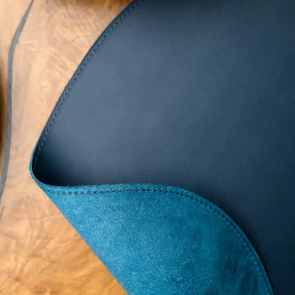 Elegant Teardrop-Shaped Placemat crafted from high-quality Capri leather. Perfect for protecting your table while adding a luxurious touch to any dining experience.