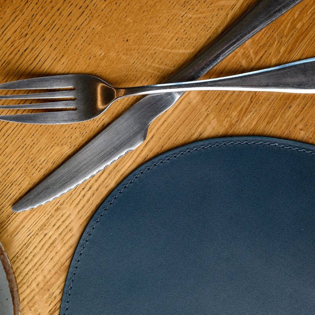 Sophisticated Teardrop-Shaped Placemat in Capri leather, perfect for modern table settings. Durable, water-resistant, and designed for everyday dining or special occasions.
