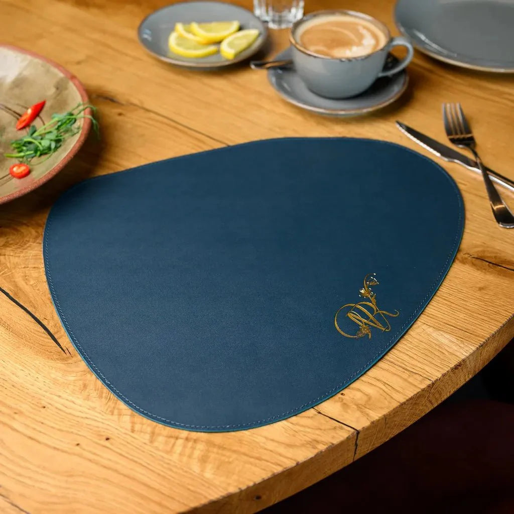 Enhance your table with a Teardrop-Shaped Placemat crafted from Capri leather. Stylish, long-lasting, and easy to clean, ideal for both casual and formal dining.