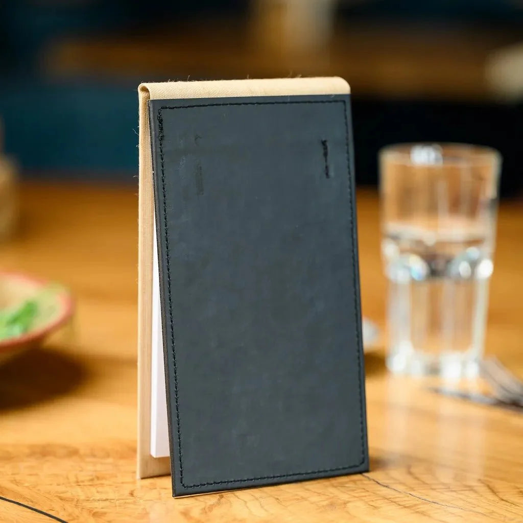 Textile Notebook with a hardcover back, perfect for waitstaff in high-traffic restaurants, offering a practical way to keep track of orders, reservations, and essential notes on the go.