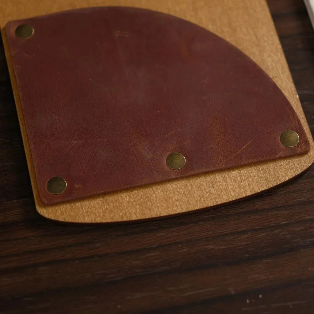 Handcrafted wooden bill holder with engraved details.