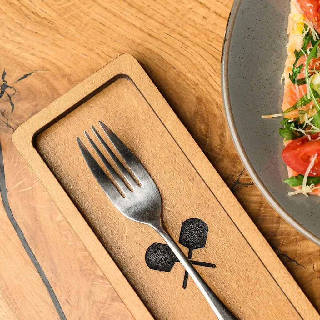 Sleek wooden cutlery holder with smooth, polished edges.