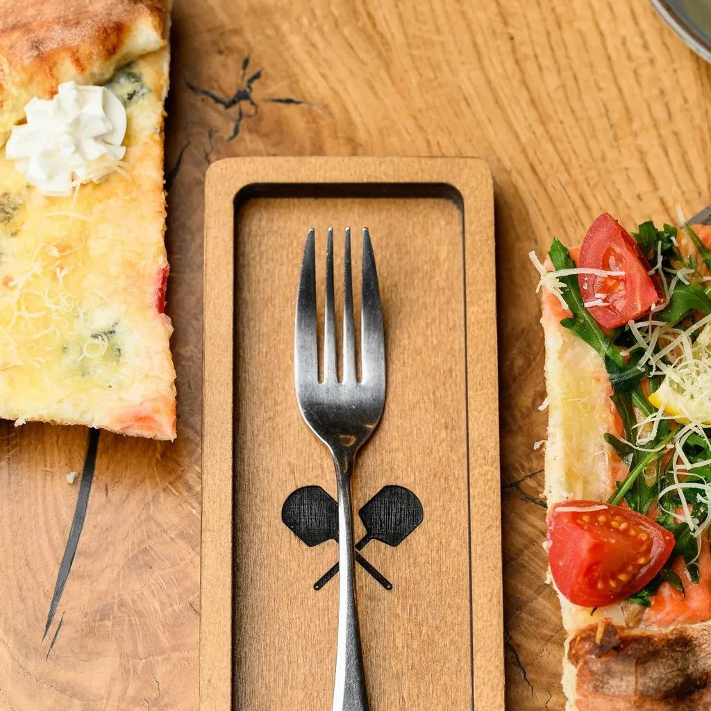 Eco-friendly wooden cutlery holder made from sustainable materials.