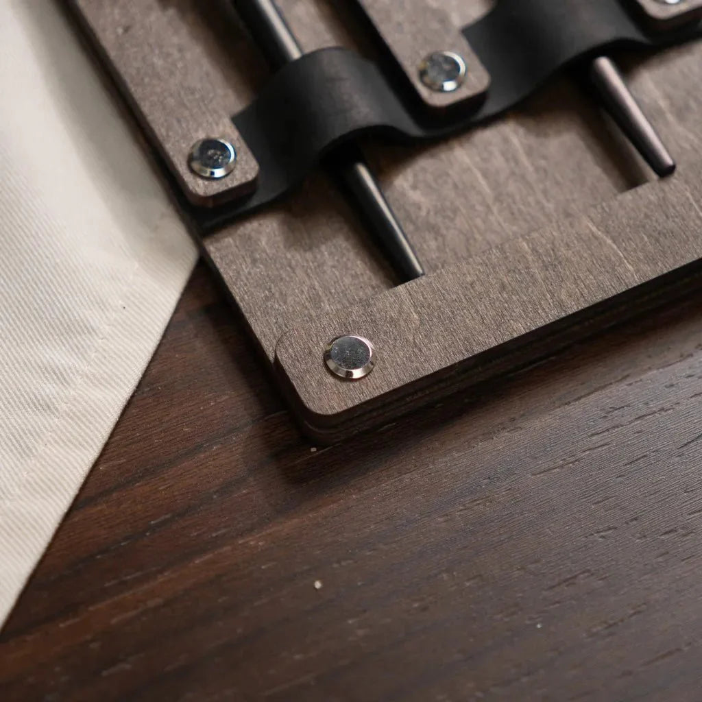 Unique engraved wooden cutlery case with logo details.