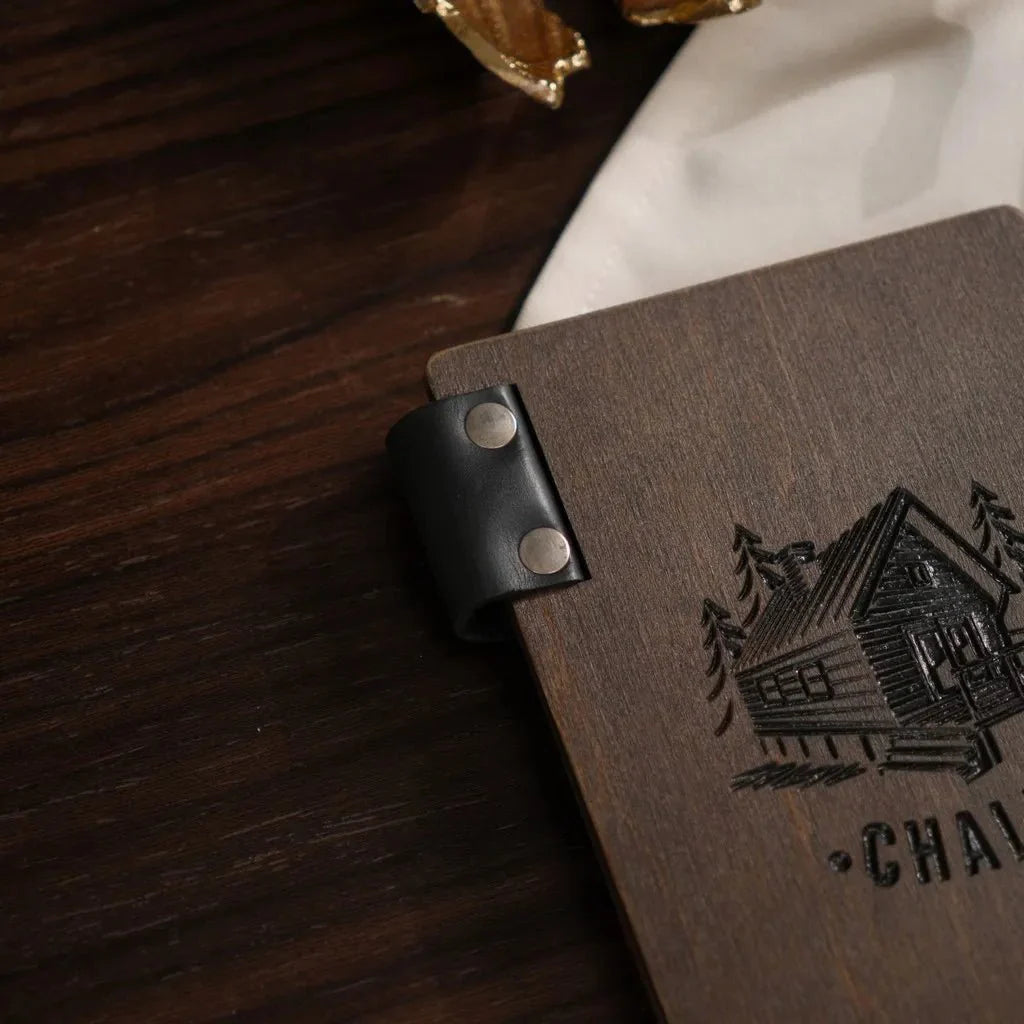 Elegant wood bill holder with laser-engraved branding.