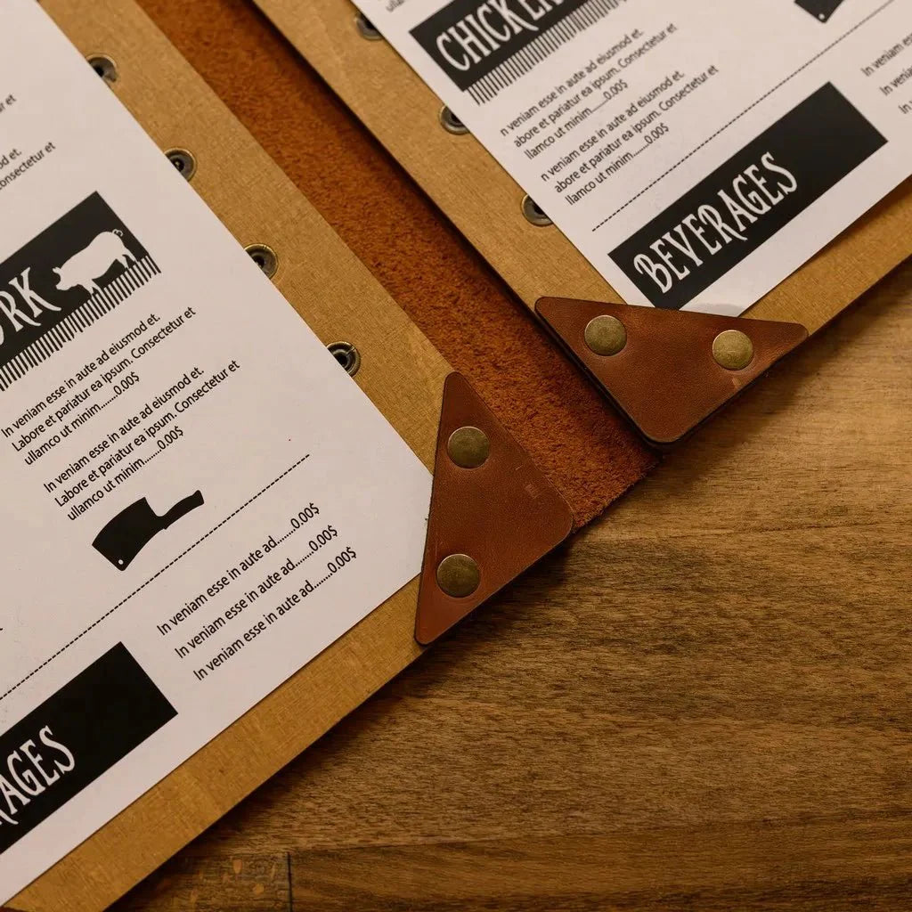 Handmade menu covers with a modern wood finish.