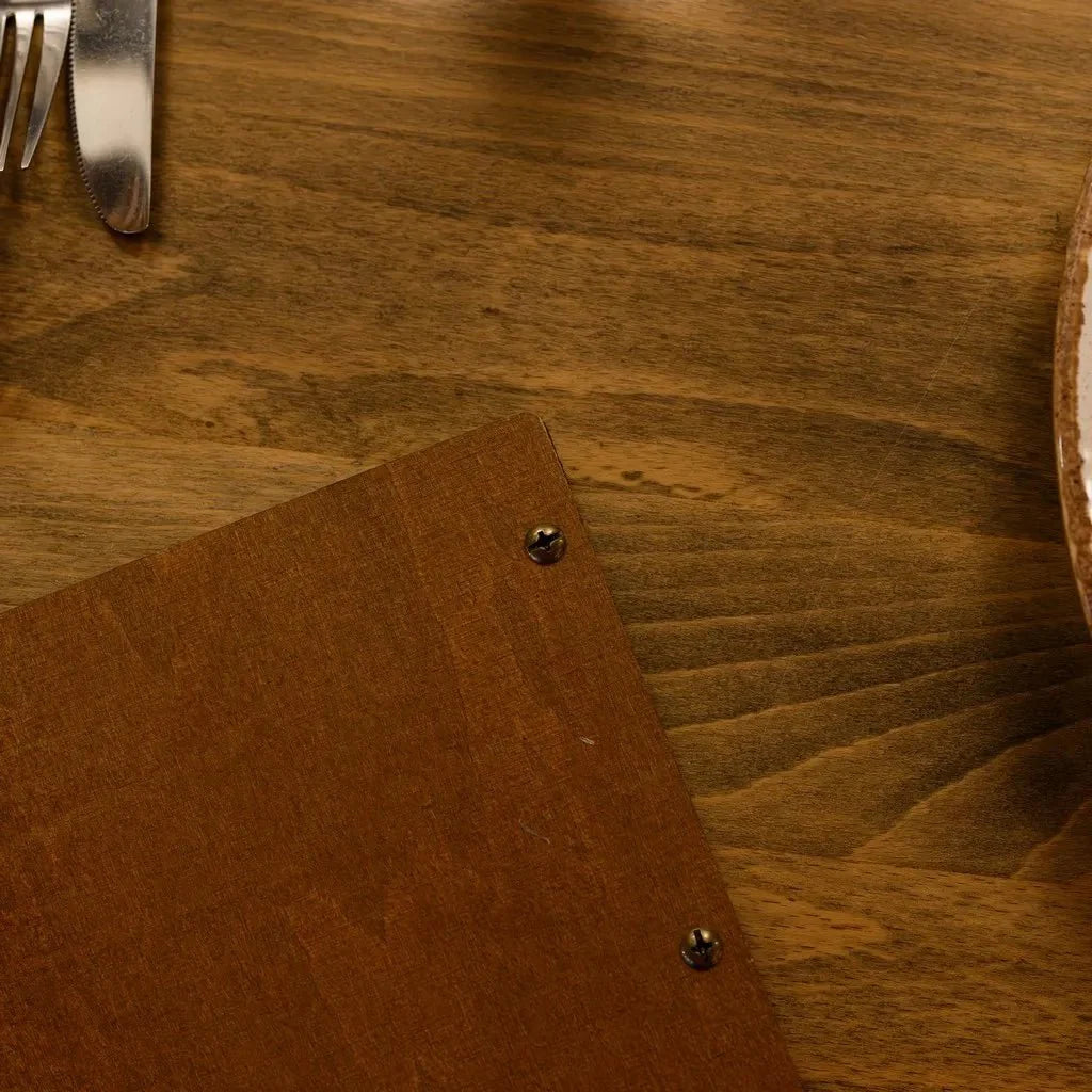 Custom-made menu sleeves for restaurants with sleek details.