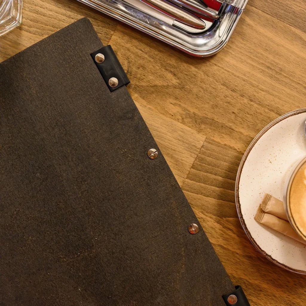Stylish menu books for restaurants with leather binding.