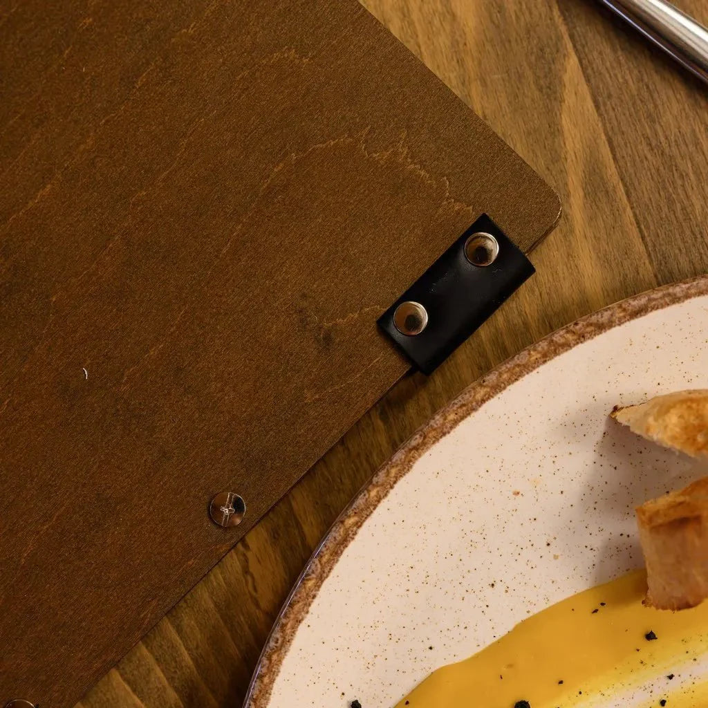 Stylish menu covers restaurant with a refined texture.