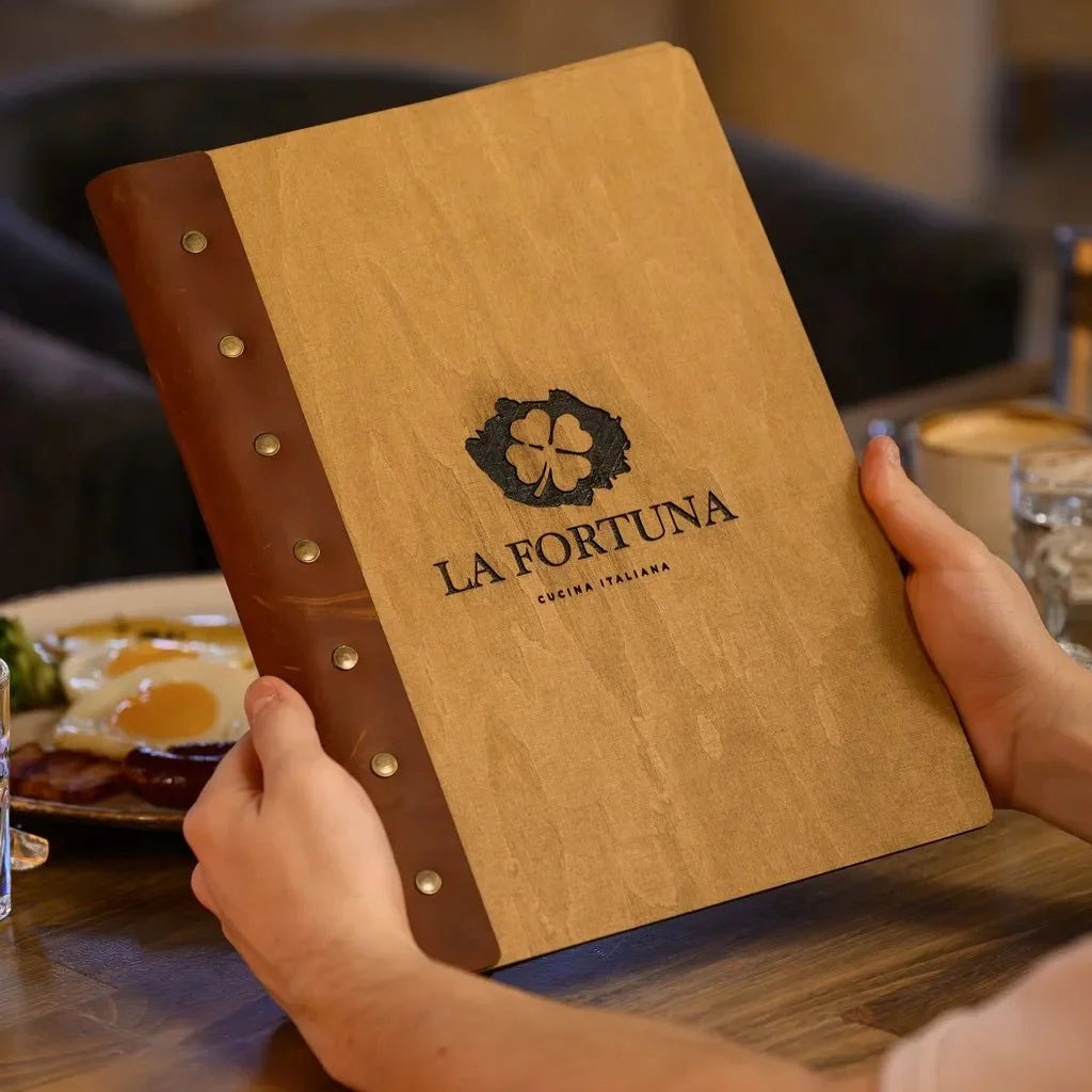 Stylish restaurant menu covers with embossed logos.