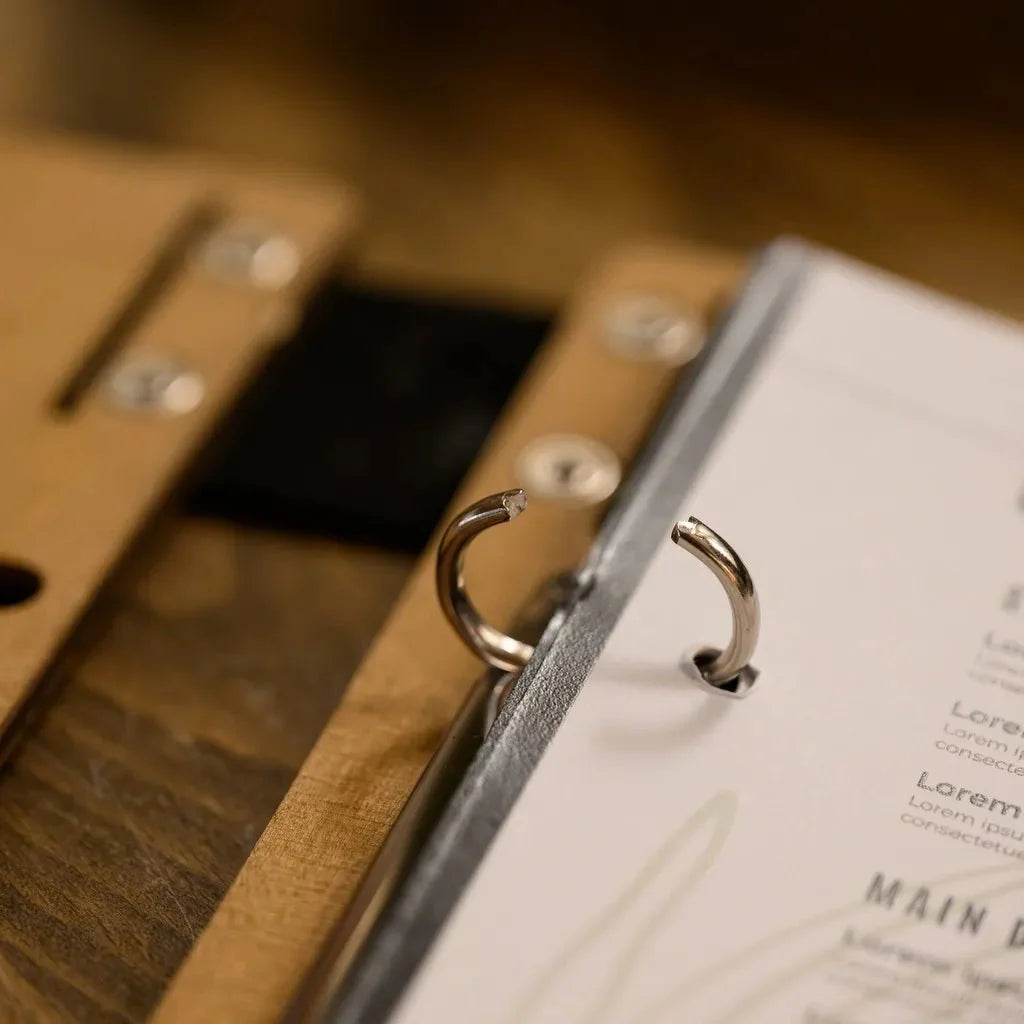 Protective menu sleeves with wooden panels.