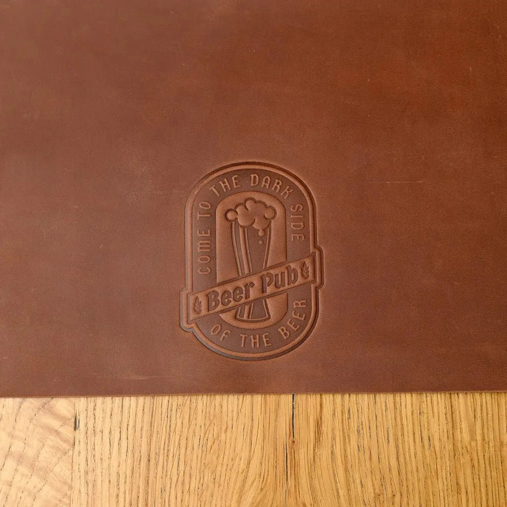 Handcrafted full-grain leather beer placemat designed to protect surfaces from spills while adding a sophisticated and rugged charm to any beer lover’s setup.