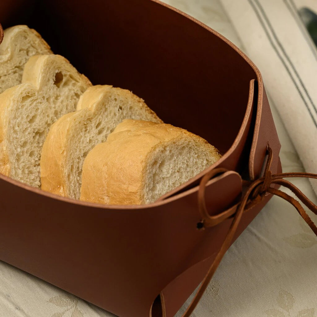 Modern leather bread bin with adjustable side cords, handmade genuine leather serving tray for kitchen countertop and dining table decor