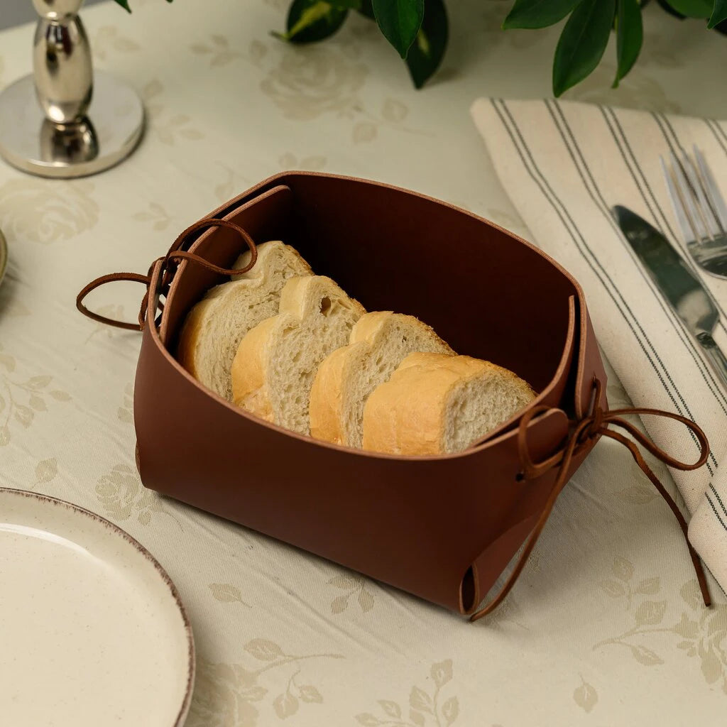 Handmade genuine leather bread box in rich cocoa brown color, featuring unique lace-up sides and durable construction for luxury table decor