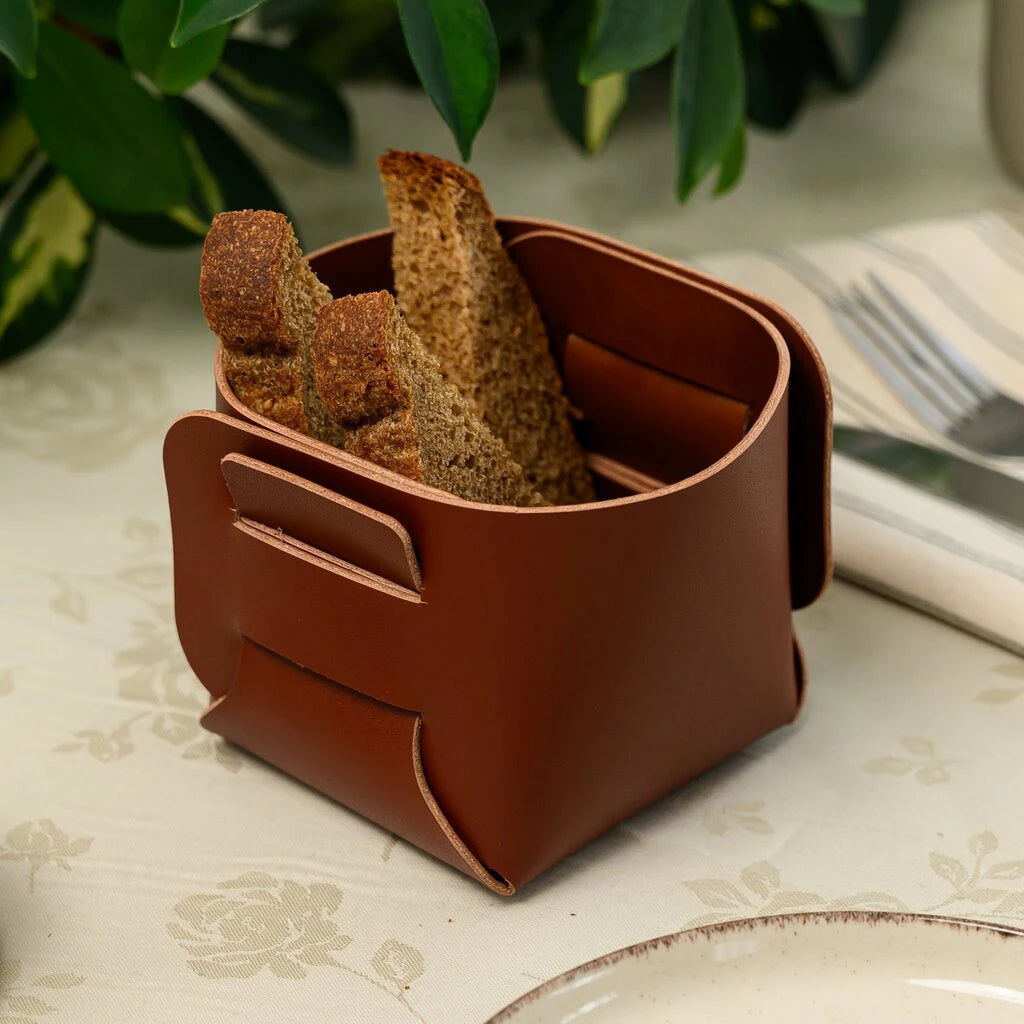 Eco-friendly and stylish kitchen storage: a handcrafted leather bread bin that brings a natural, rustic touch to your dining table decor