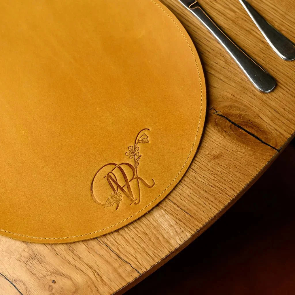 Circle-Shaped Placemat in Crazy Horse leather, crafted for durability and elegance. Water-resistant and stylish, it develops a rich patina over time for a unique look.