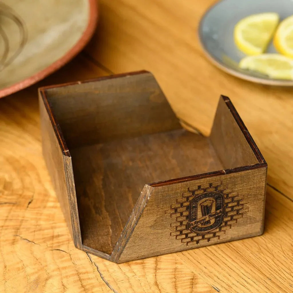 Handcrafted wooden napkin holder with deep engraving.