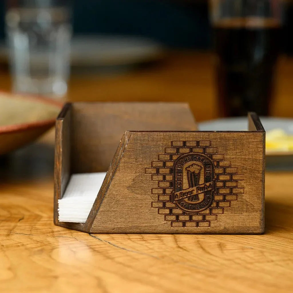 Custom wood napkin holder with a laser-engraved logo.