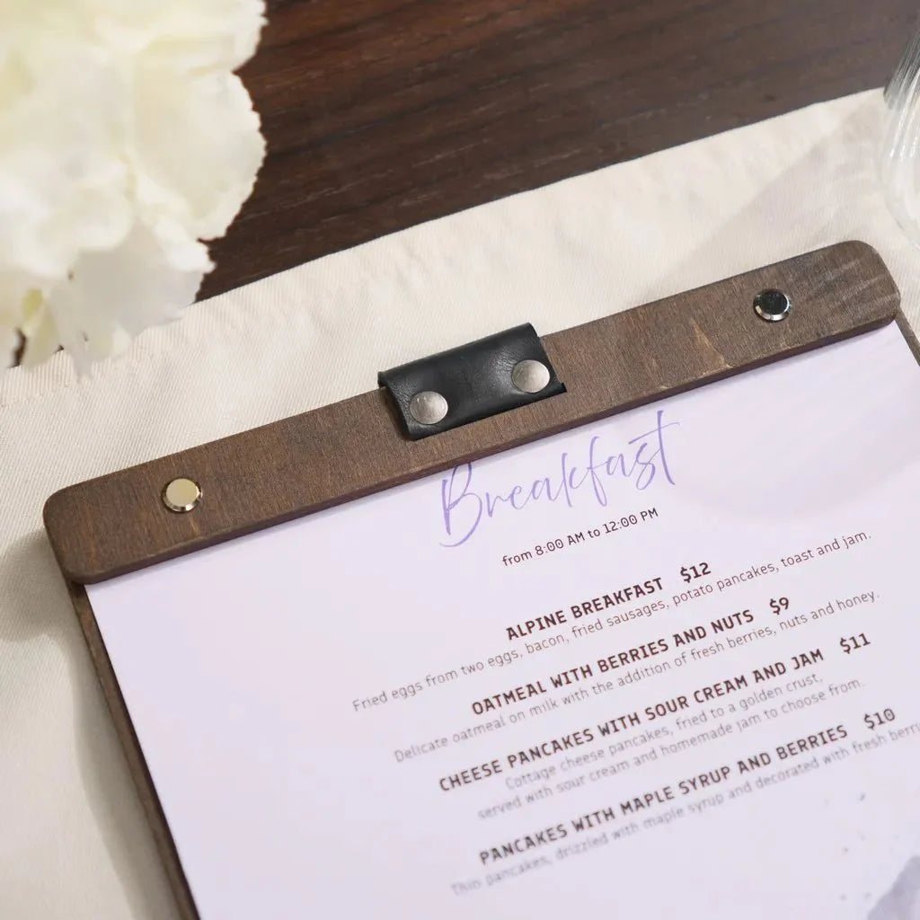 Engraved wooden menu clipboard for a rustic, elegant touch.