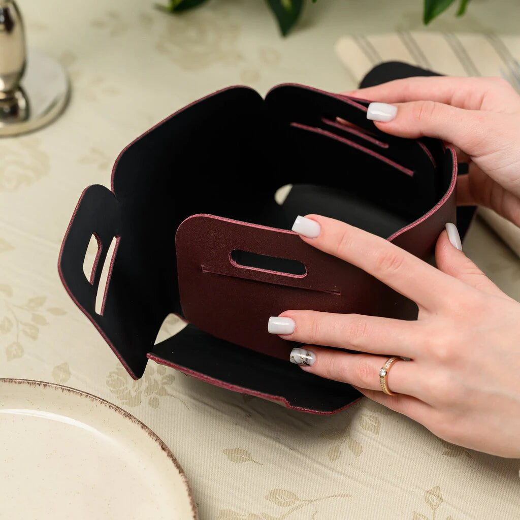 A unique one-piece leather pattern for a no-stitch bread basket. The image highlights the flat-packed design and easy-to-assemble interlocking mechanism of the premium leather accessory