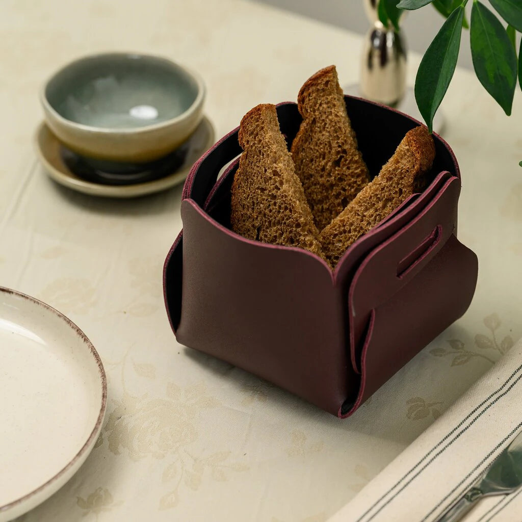 Elegant deep wine-red leather bread bin, handcrafted for a sophisticated table setting. A perfect blend of functional design and rich color